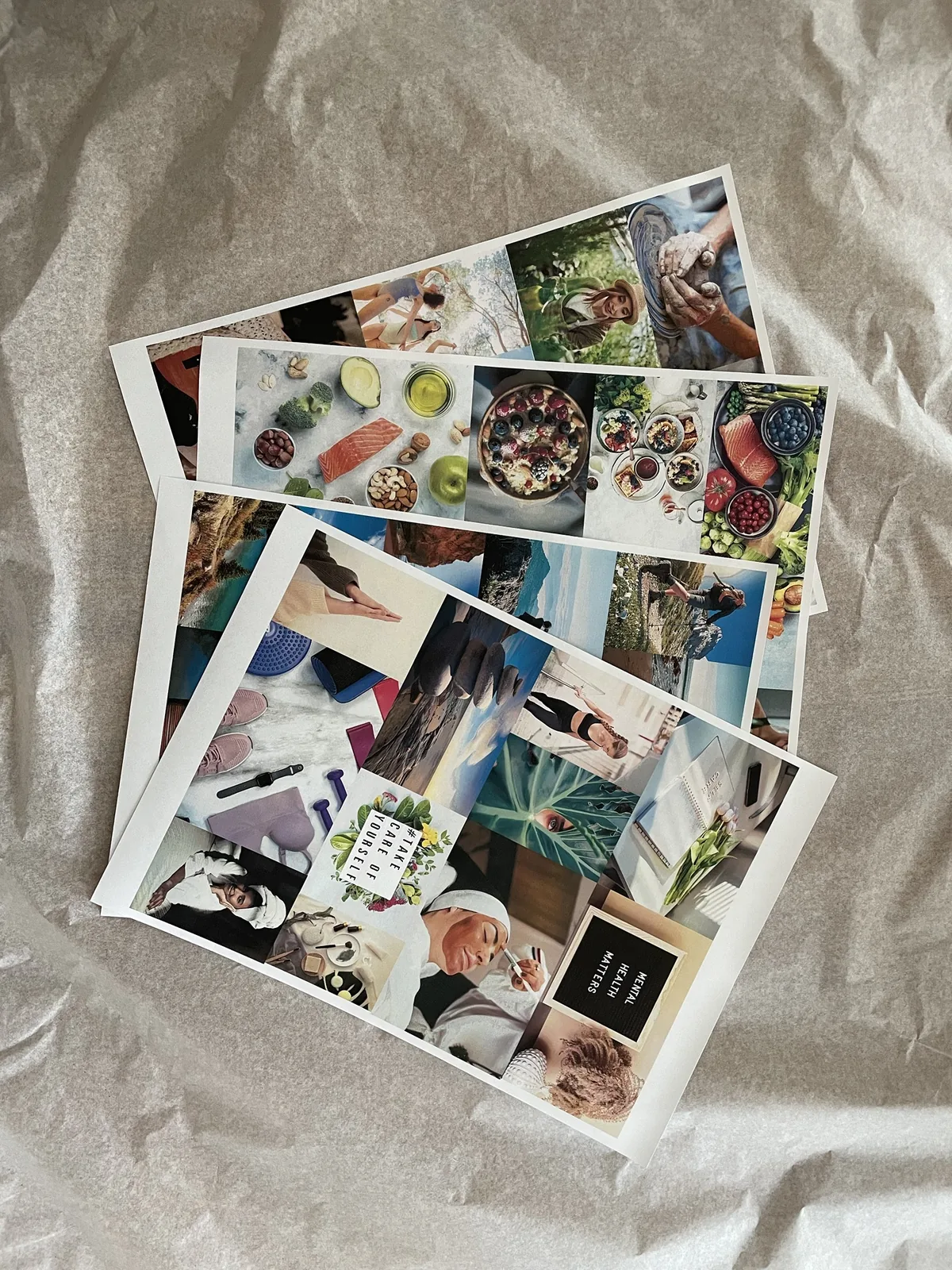 Ausgedruckte Fotobögen für mein Vision Board: gesundes Essen, Wandern, Yoga und Selfcare-Motive