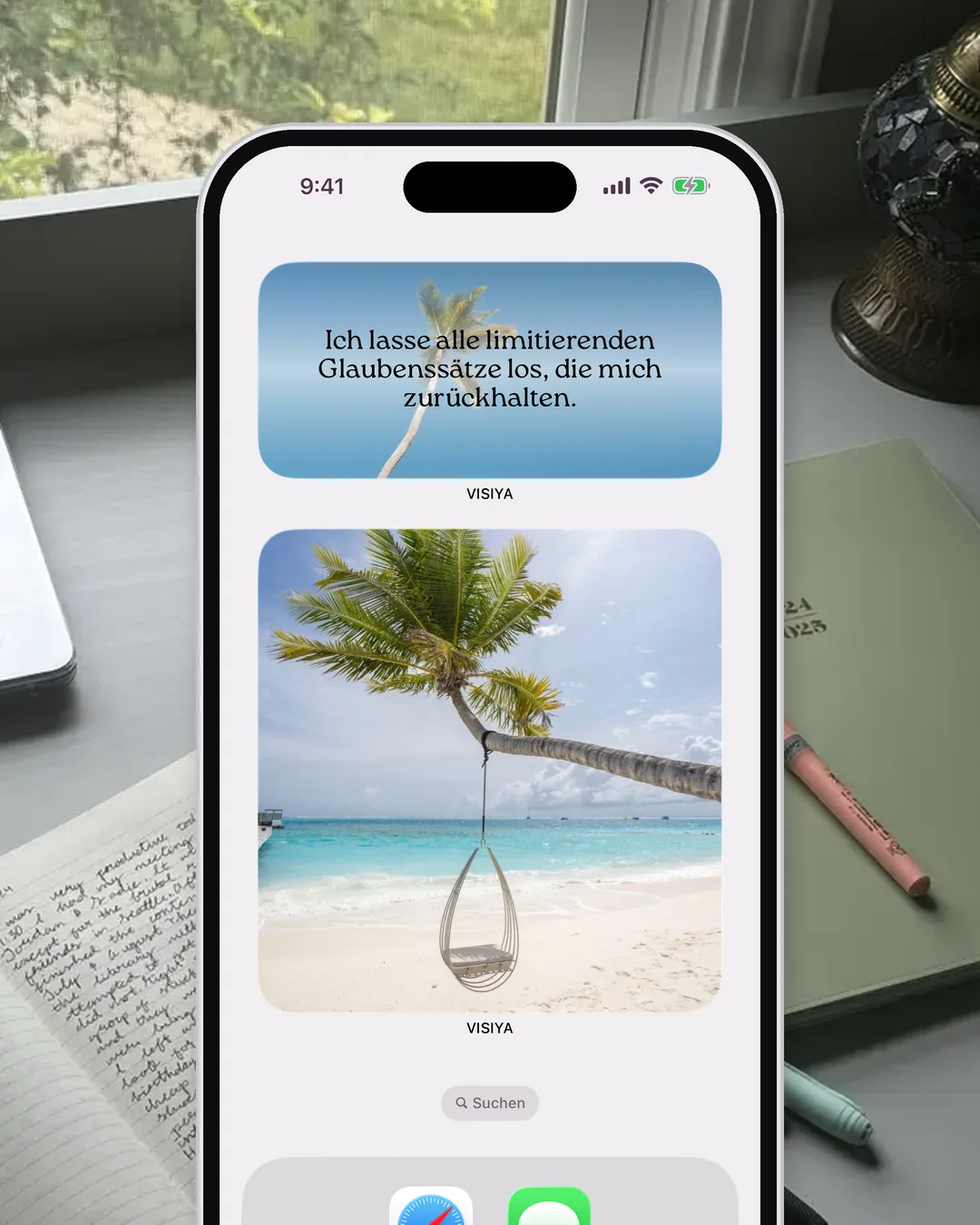 Der Home-Bildschirm eines iPhones mit dem Affirmations-Widget und dem Vision-Board-Widget von VISIYA