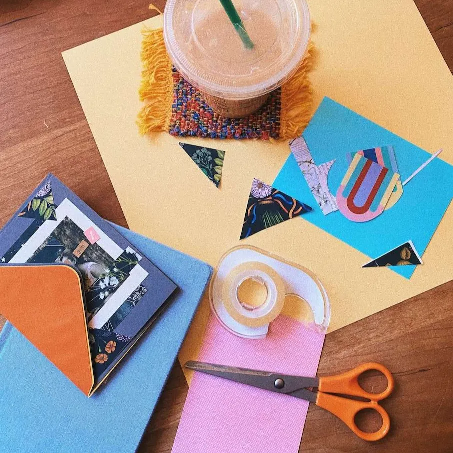 Paper cutouts and photos arranged into a colourful vision board collage