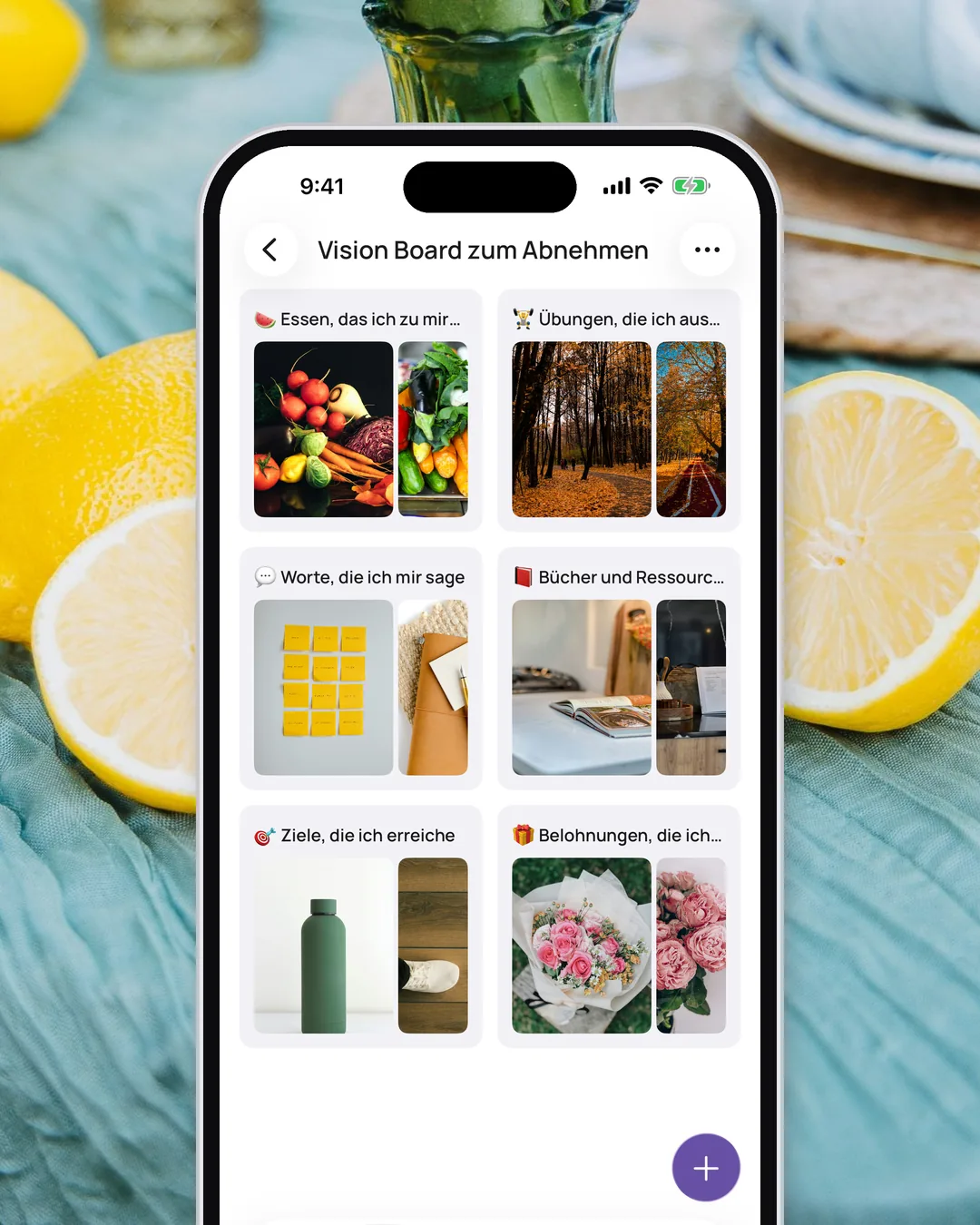 Das Vision Board zum Abnehmen in der VISIYA-App mit sechs Bereichen und Emojis, auf salbeigrünem Leinen neben frischen Zitronen