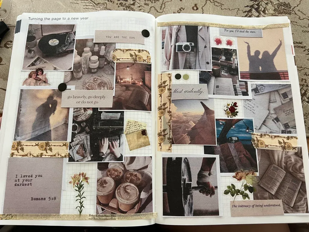 A calm, beige-toned vision board scrapbook filled with photos, quotes and floral stickers