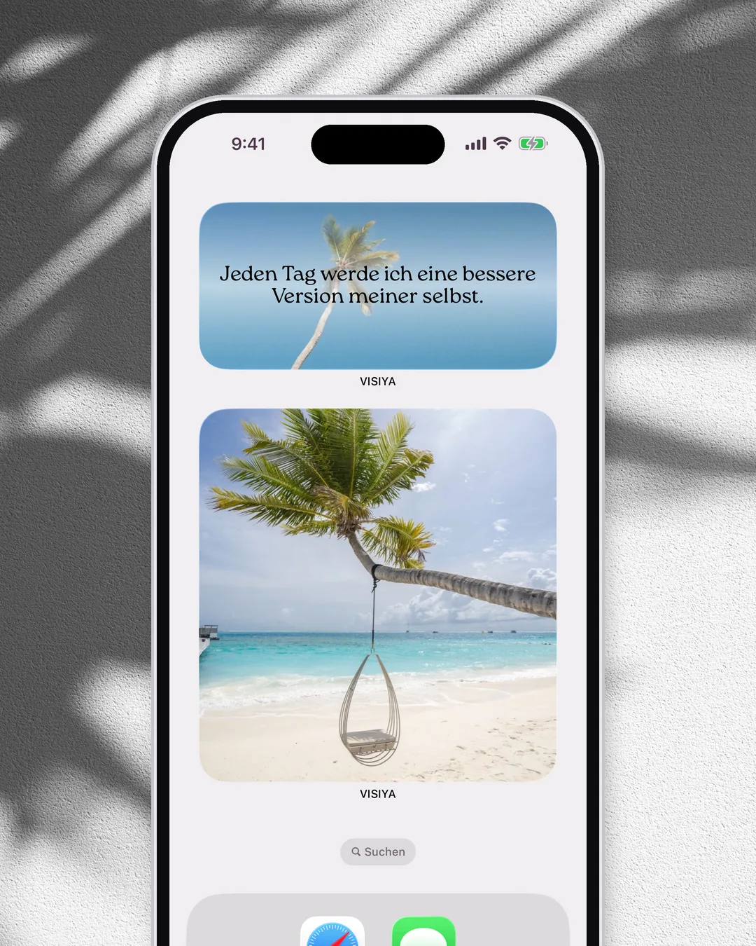 Ein iPhone-Home-Bildschirm mit dem Widget „Tägliche Affirmation“ von VISIYA über einem Vision-Board-Widget