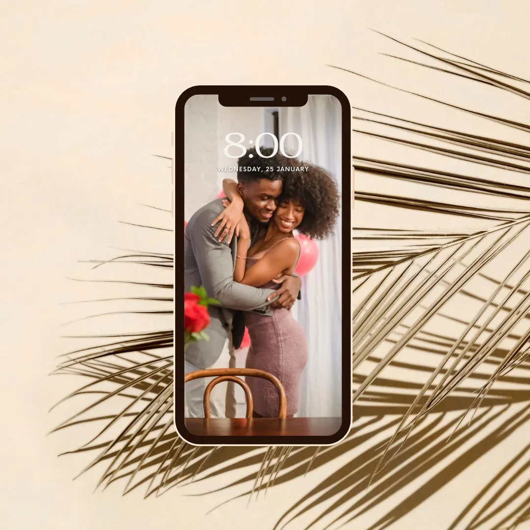 Phone lock screen showing an embracing couple, framed by soft dried palm shadows on beige